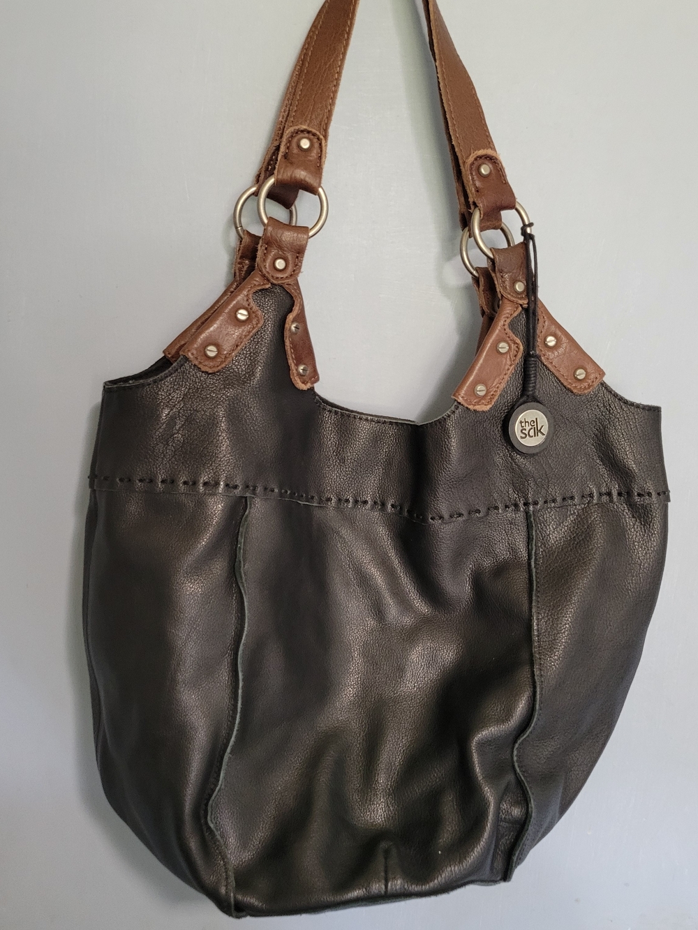 The Sak Indio Black Leather Shoulder Bag with Double Brown Straps